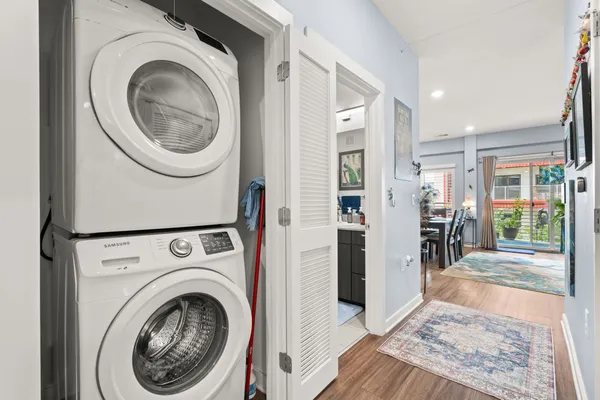 a view of a hallway with washer and dryer