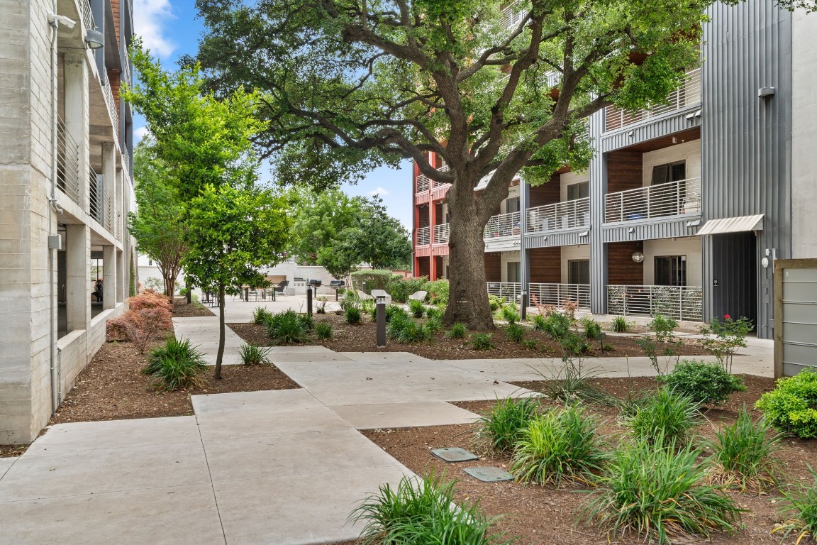 4361 South Congress Avenue, Unit 237 Austin, TX 78745 - Photo 22 of 28 a front view of a house with garden