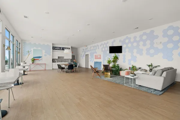 a living room with furniture and a flat screen tv