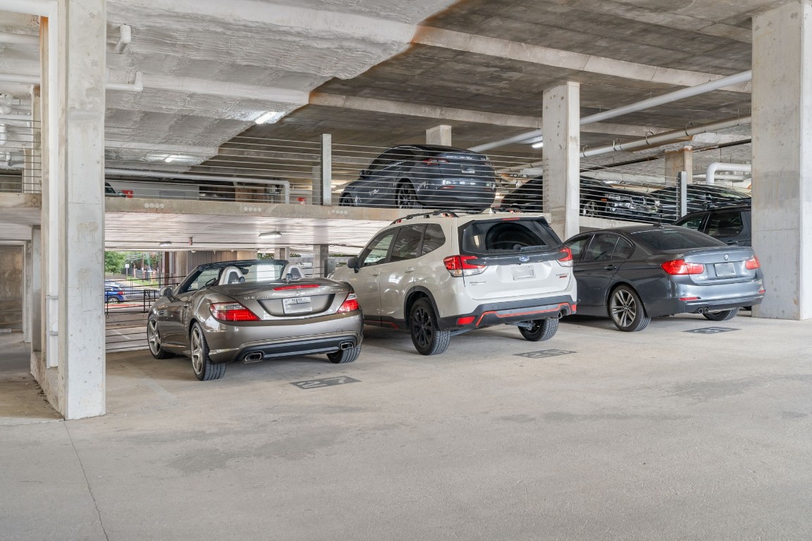 4361 South Congress Avenue, Unit 237 Austin, TX 78745 - Photo 28 of 28 a view of parking garage with cars and parking