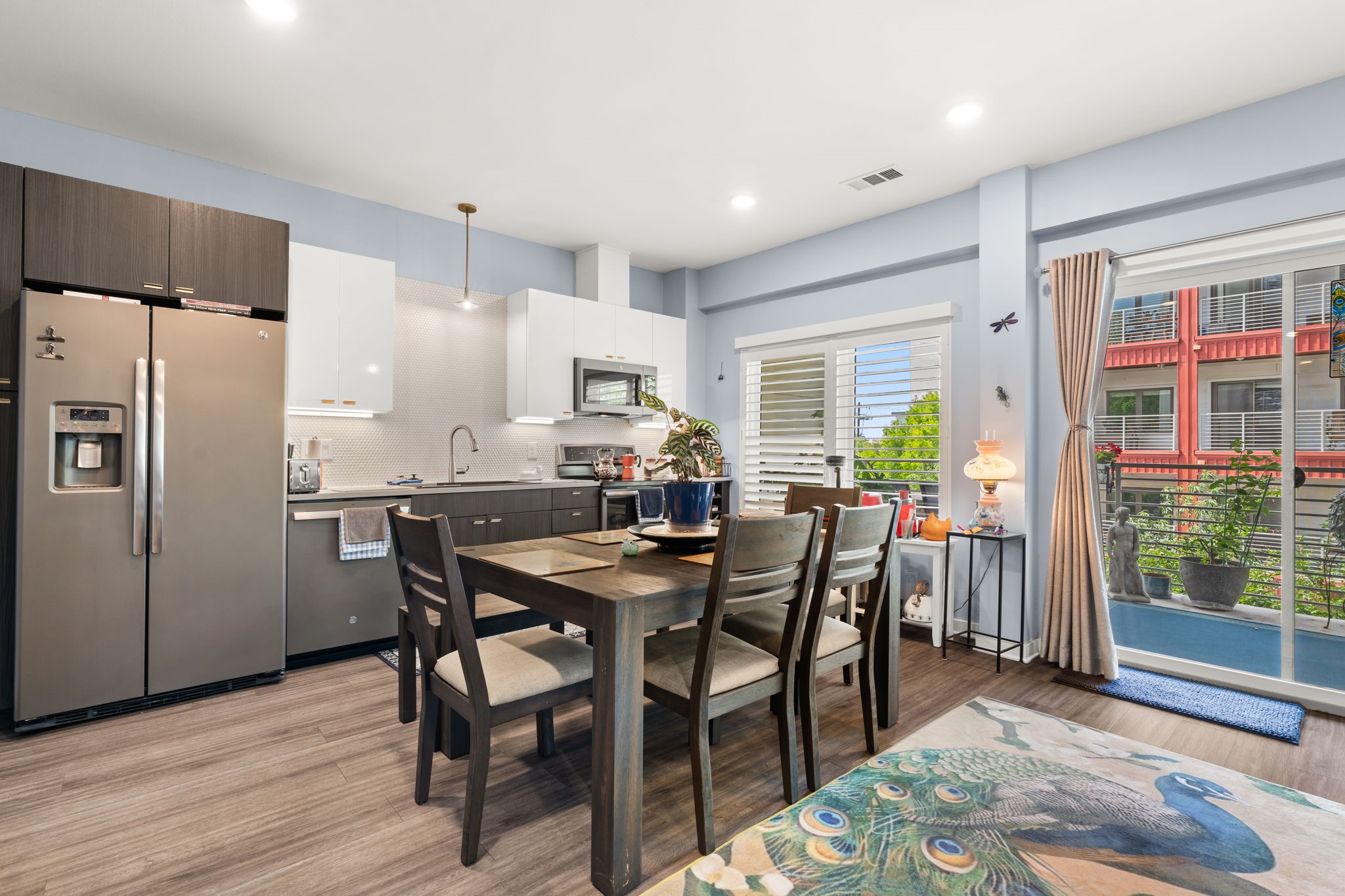 4361 South Congress Avenue, Unit 237 Austin, TX 78745 - Photo 6 of 28 a view of a dining room with furniture and wooden floor