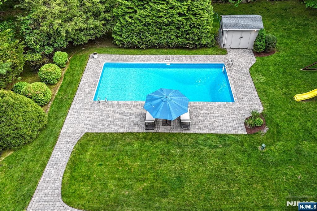 60 Dimmig Road Upper Saddle River, NJ 07458 - Photo 6 of 40 swimming pool with outdoor seating and yard