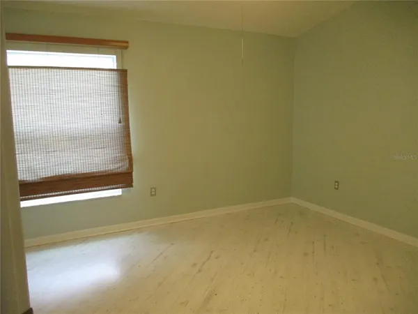 a view of a room that has a window in it