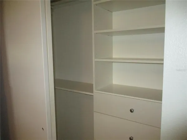 a view of an empty walk in closet