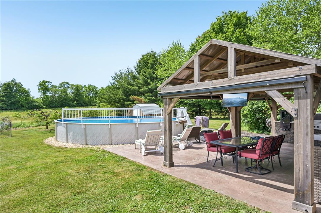 4065 Airport Road Allentown, PA 18109 - Photo 24 of 28 A private outdoor oasis with a sparkling pool and shaded entertaining area beckons.