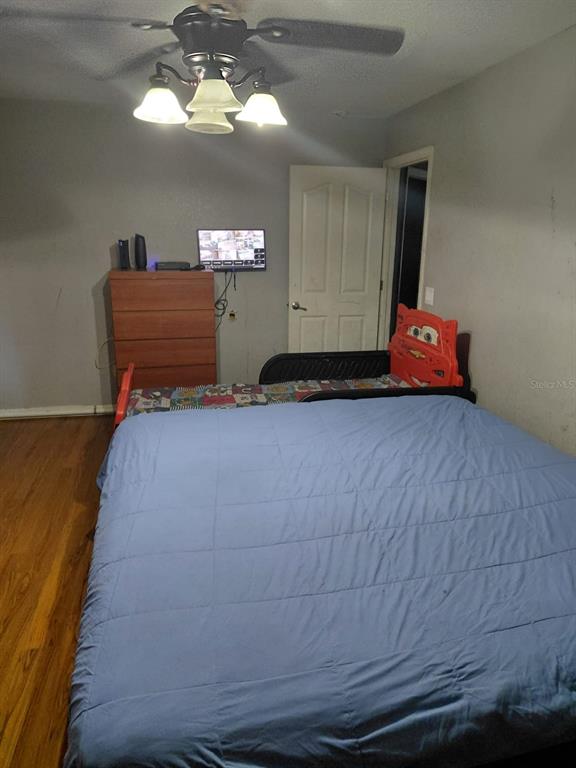 11382 Mahopac Road Weeki Wachee, FL 34614 - Photo 12 of 35 a room with a bed and window
