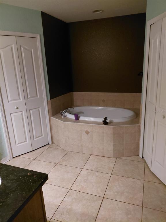 11382 Mahopac Road Weeki Wachee, FL 34614 - Photo 13 of 35 a view of a bathtub in a bathroom