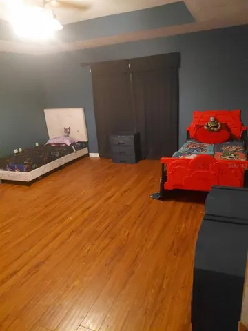 a bed room with a bed and a computer