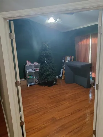 a bedroom with a bed and a mirror