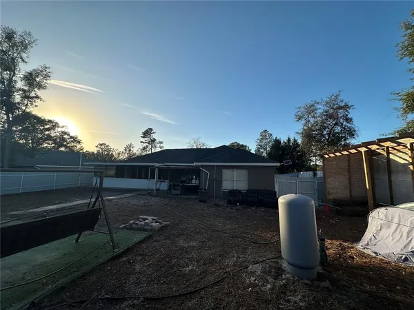 a view of house with outdoor space and sitting area