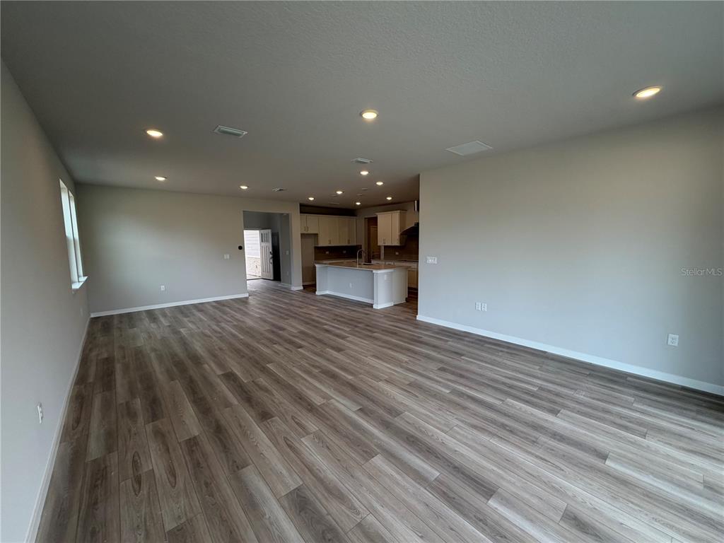 57 Pegasus Road Flagler Beach, FL 32136 - Photo 16 of 45 a view of empty room with wooden floor
