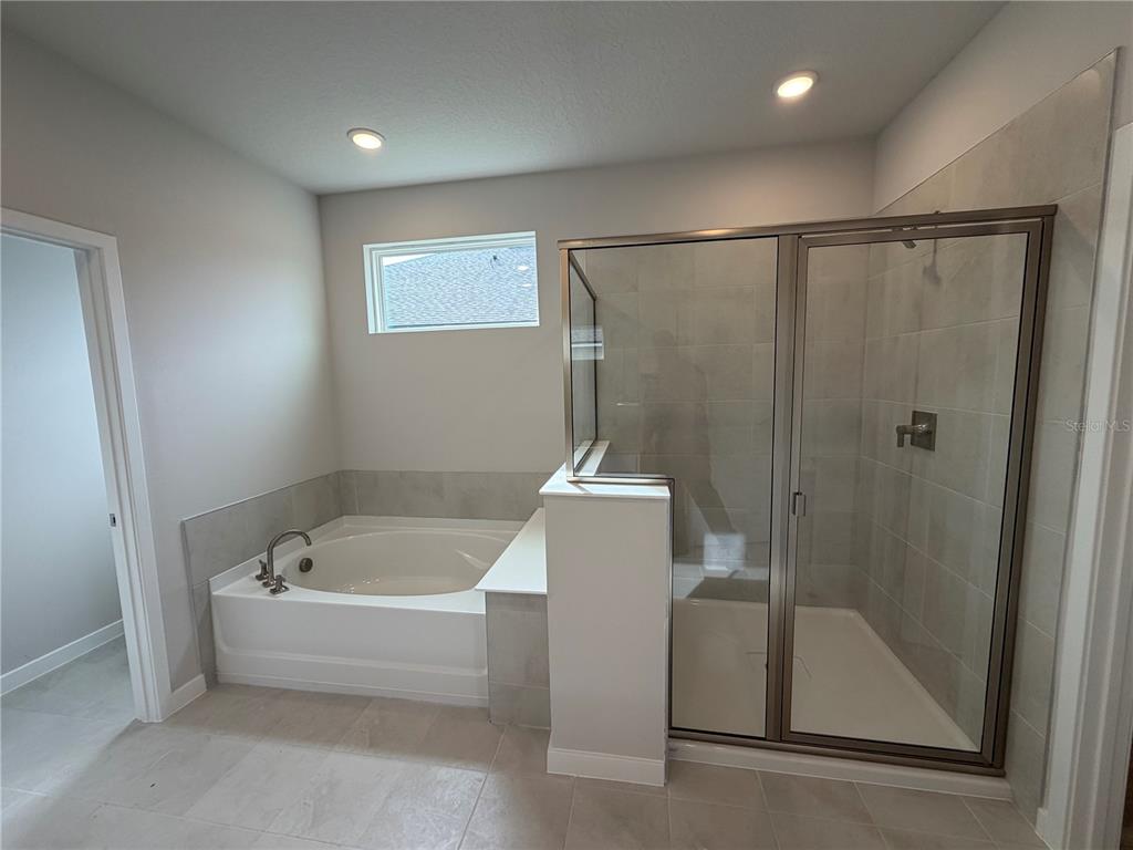 57 Pegasus Road Flagler Beach, FL 32136 - Photo 21 of 45 a bathroom with a tub and a shower