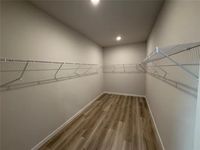 a view of a room with racks on the wall