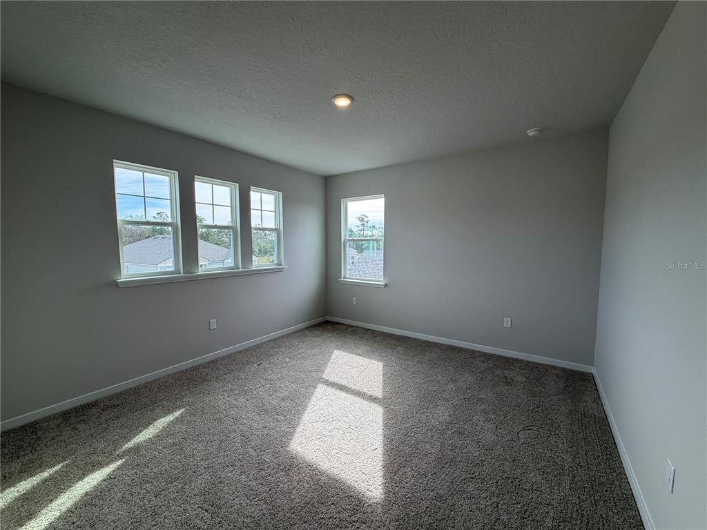 57 Pegasus Road Flagler Beach, FL 32136 - Photo 27 of 45 an empty room with windows