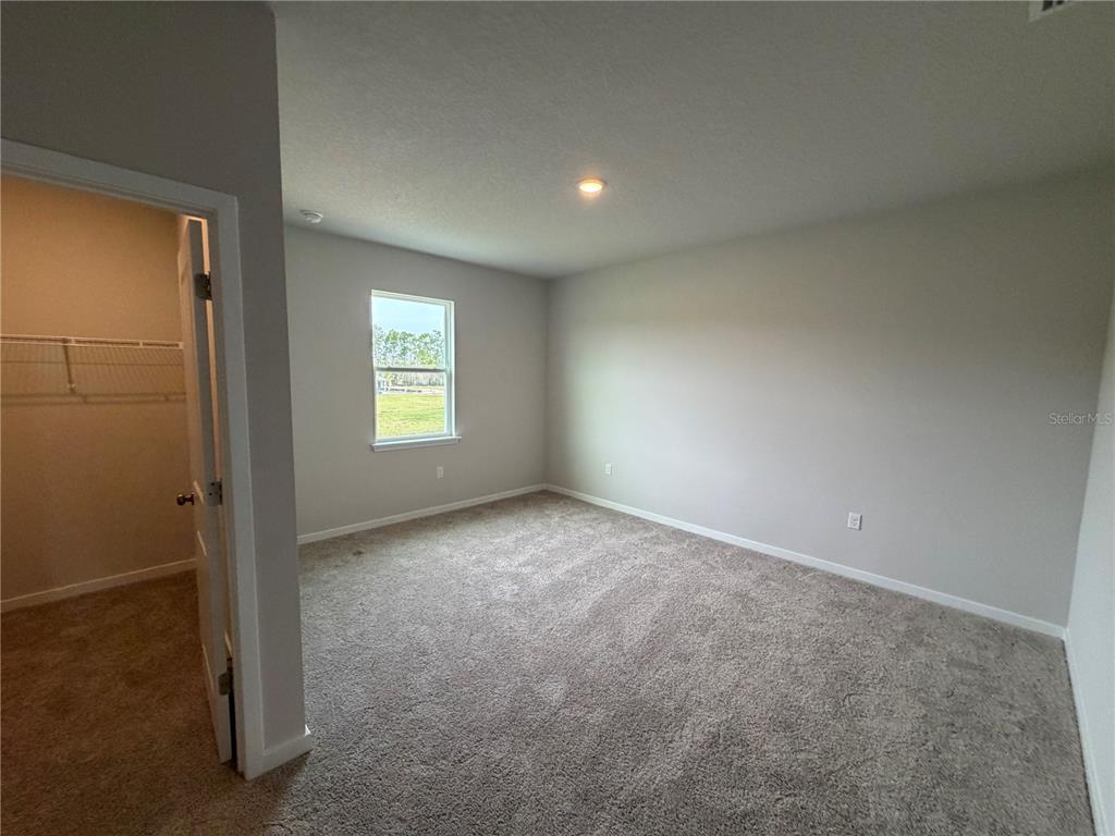 57 Pegasus Road Flagler Beach, FL 32136 - Photo 30 of 45 an empty room with windows and closet