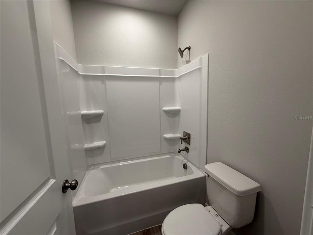 57 Pegasus Road Flagler Beach, FL 32136 - Photo 33 of 45 a bathroom with a toilet and bathtub