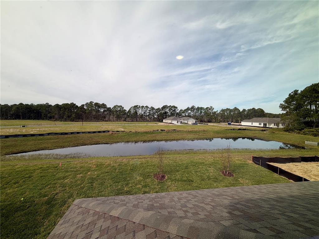 57 Pegasus Road Flagler Beach, FL 32136 - Photo 36 of 45 a view of a lake with houses in the background