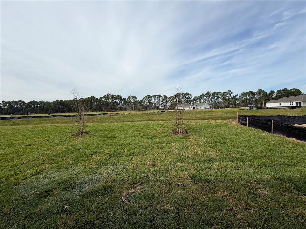57 Pegasus Road Flagler Beach, FL 32136 - Photo 41 of 45 a view of a lake with houses in the background