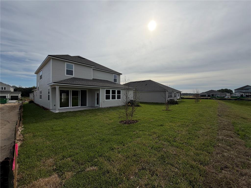 57 Pegasus Road Flagler Beach, FL 32136 - Photo 43 of 45 a front view of a house with a yard
