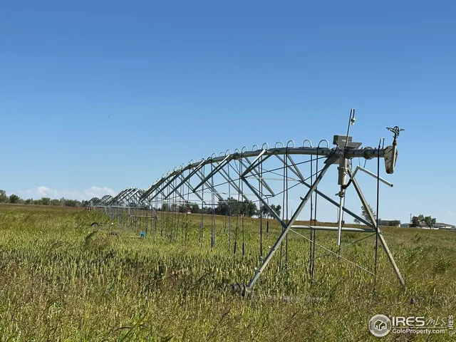a view of a lake with a yard