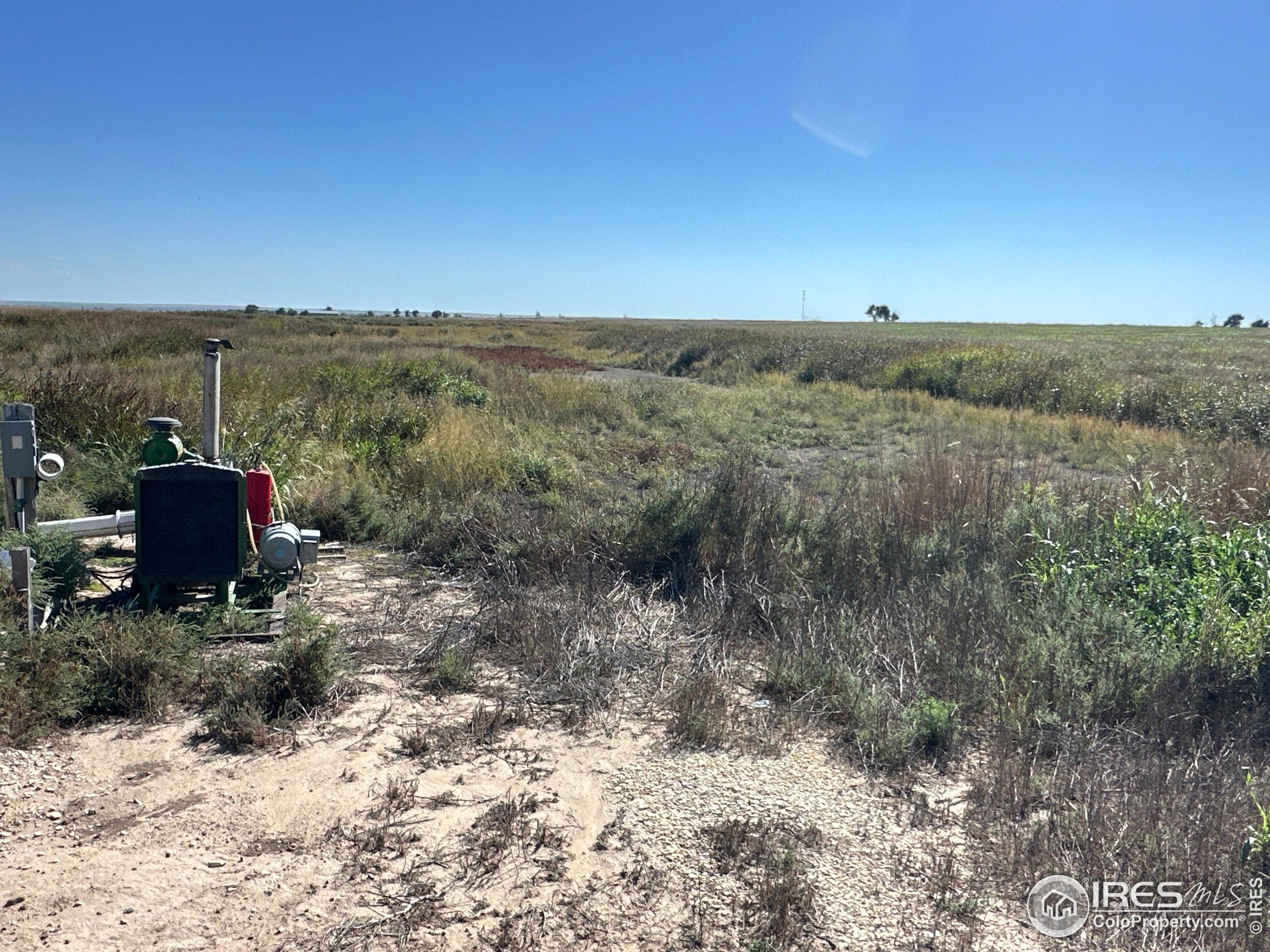 89 Hh Roads, Unit 11 Holly, CO 81047 - Photo 3 of 18 a view of a dry yard with wooden fence