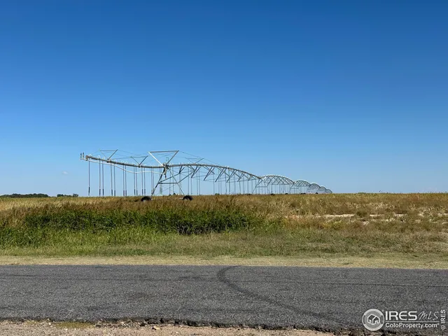 a view of a road with an ocean beach