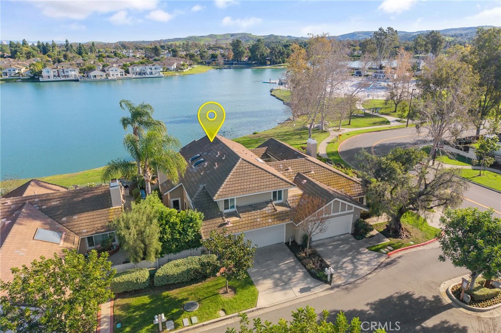 an aerial view of a house with a swimming pool outdoor seating and yard view