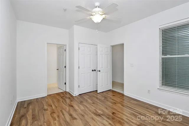 a view of a livingroom with a chandelier fan