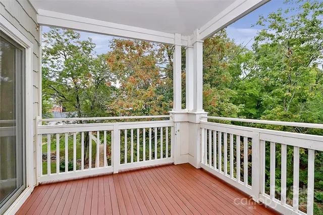 a view of a two chairs in the balcony