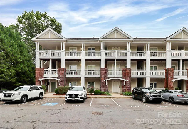 a car parked in front of a big house