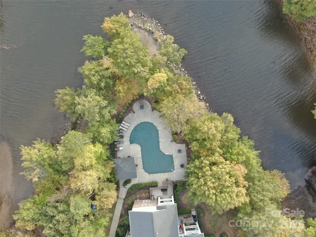 a bathroom with a sink mirror and toilet