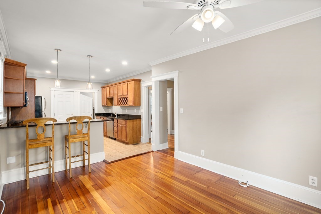 226 East Cottage Street, Unit 1 Boston, MA 02125 - Photo 5 of 12 a view of kitchen with cabinets and wooden floor