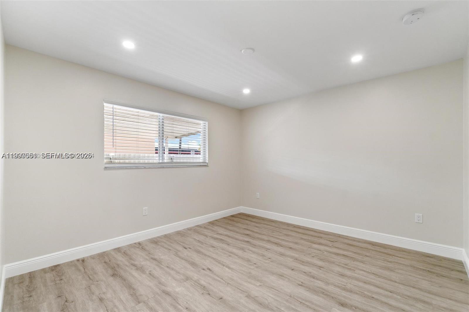 330 West 74th Place, Unit 330 Hialeah, FL 33014 - Photo 15 of 31 wooden floor in a room