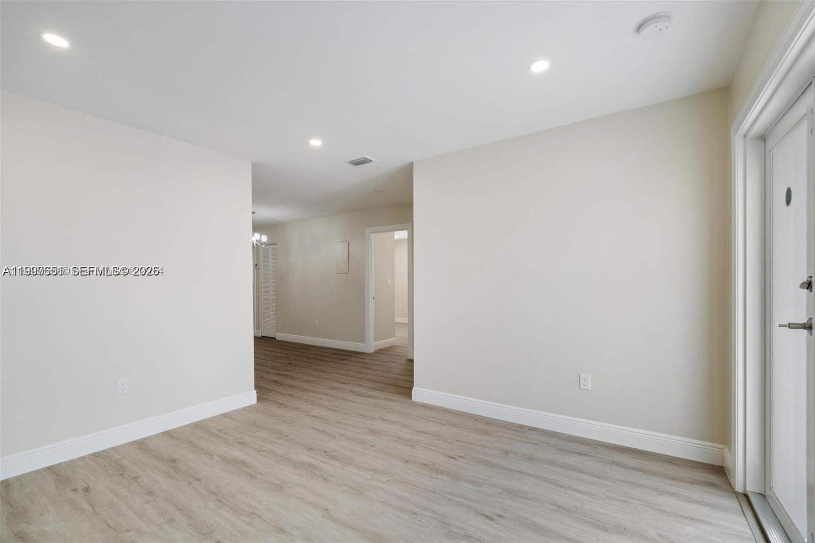330 West 74th Place, Unit 330 Hialeah, FL 33014 - Photo 28 of 31 a view of an empty room with wooden floor