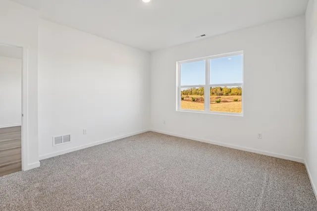 a bathroom with a double vanity sink and mirror