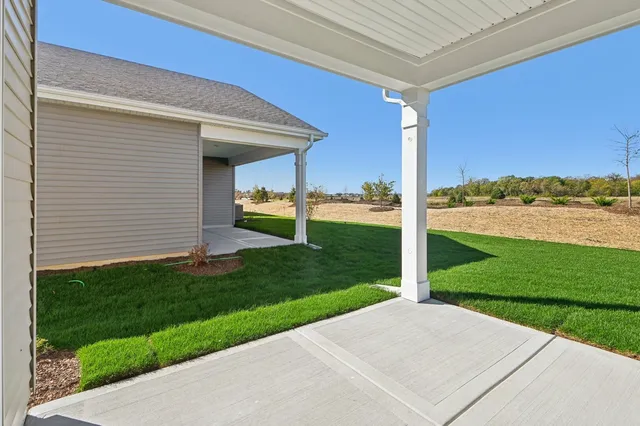 a sign of golf club on a wall under a white wall
