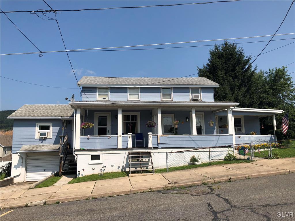 13 West Ruddle Street, Unit 15 Coaldale, PA 18218 - Photo 1 of 3 a front view of a house with yard