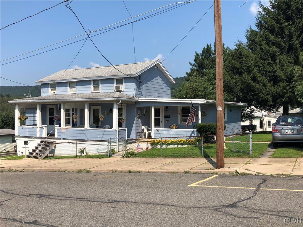 13 West Ruddle Street, Unit 15 Coaldale, PA 18218 - Photo 3 of 3 a view of a house with a yard and sitting area
