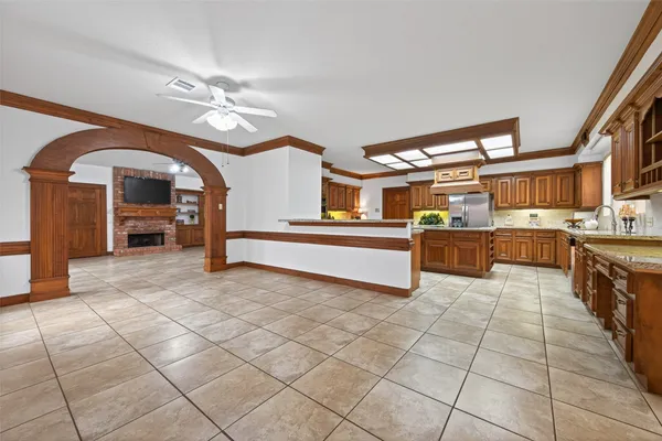 a kitchen with stainless steel appliances granite countertop a sink and cabinets