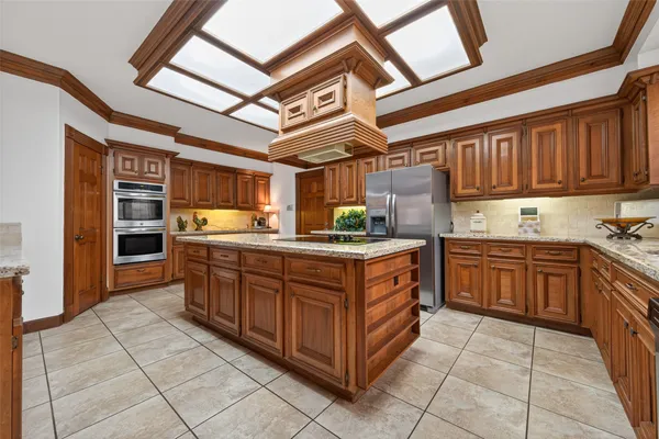 a view of kitchen with microwave and cabinets