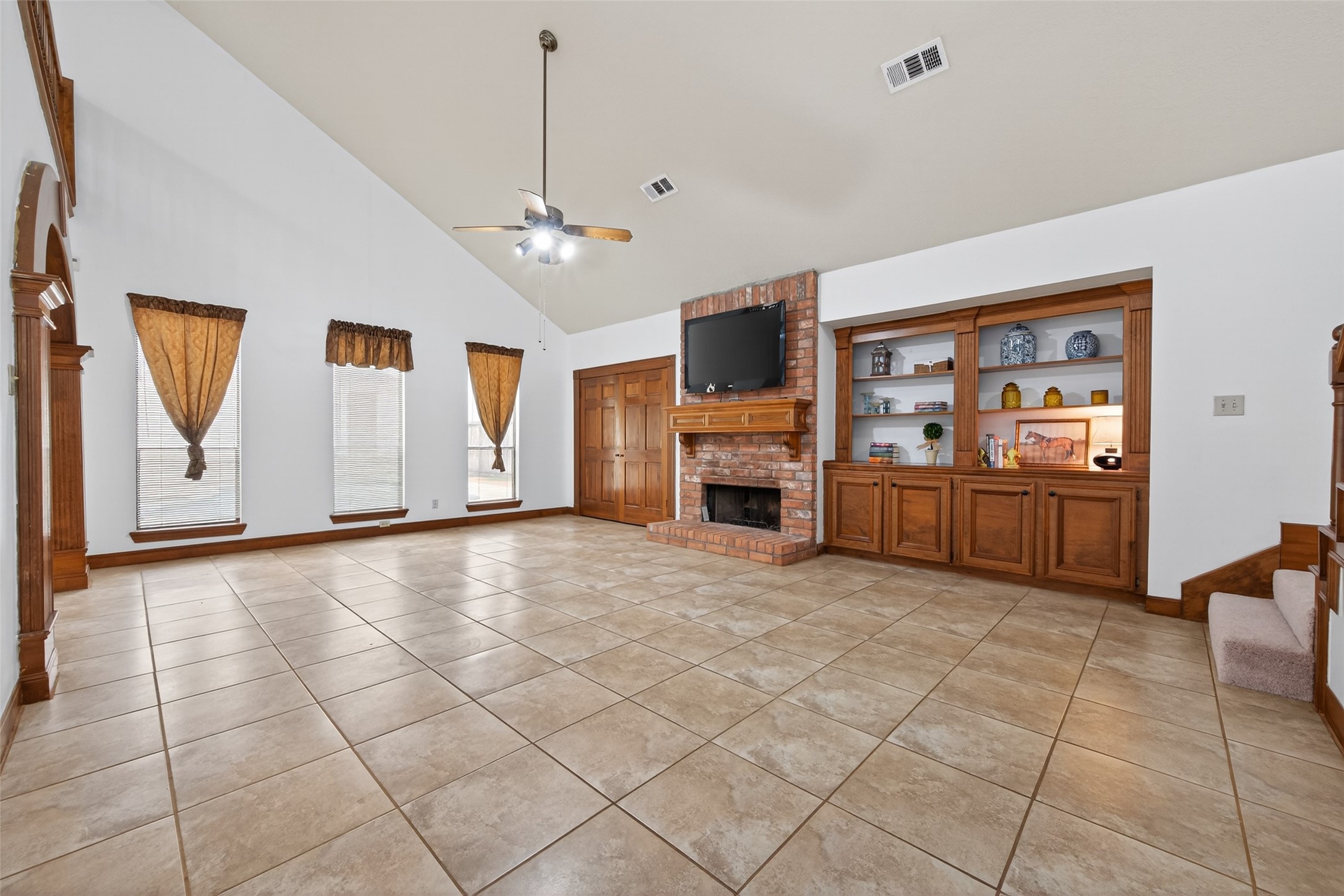 17315 Rothko Lane Spring, TX 77379 - Photo 18 of 50 Spacious family room designed for entertaining and relaxing, offering exceptional comfort with an open layout and inviting atmosphere.