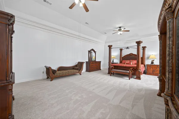 a view of a kitchen with a sink and a chandelier fan