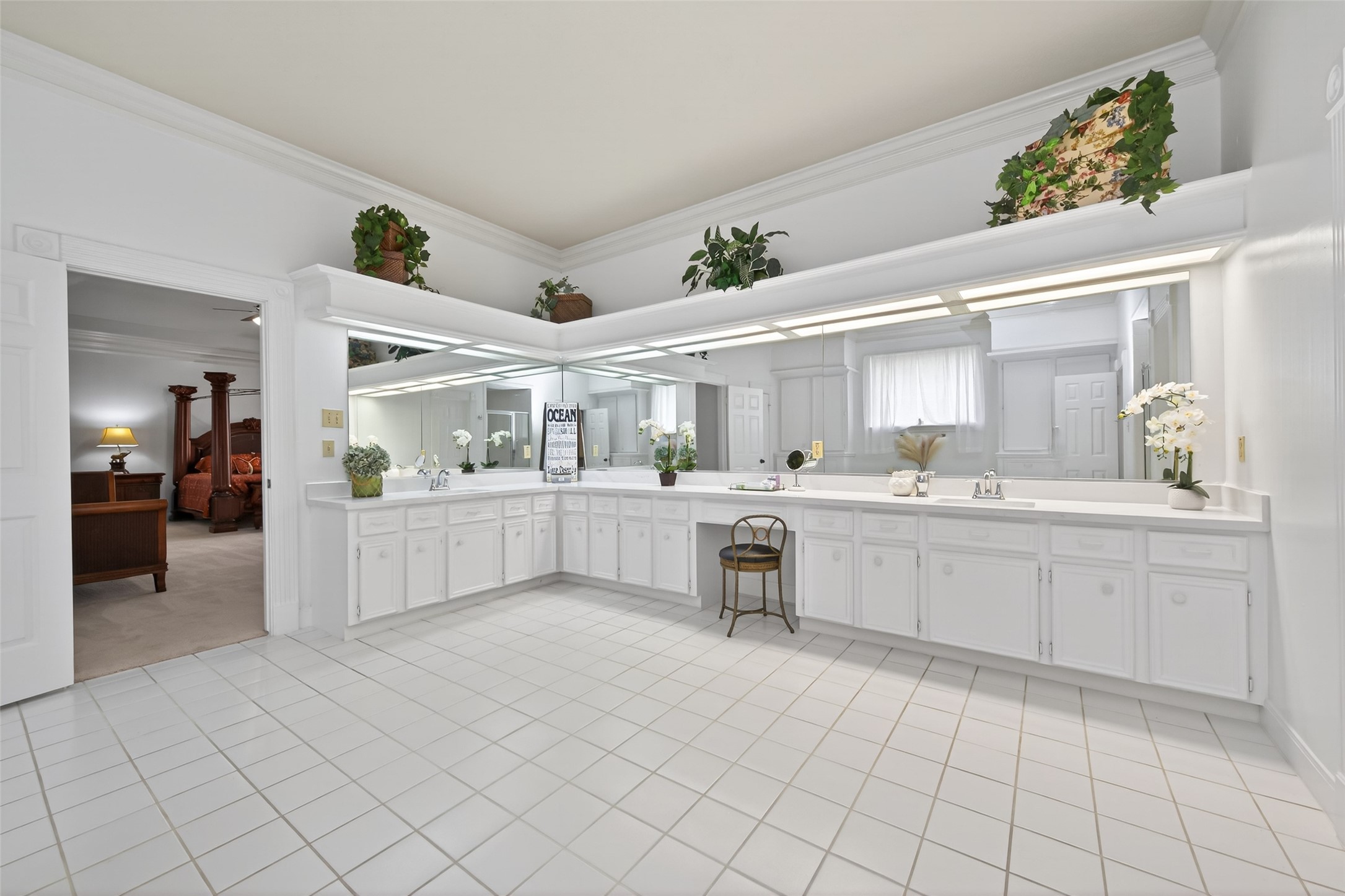 17315 Rothko Lane Spring, TX 77379 - Photo 22 of 50 This spacious primary bathroom features an expansive dual-sink vanity, abundant counter space, and cabinetry. The bright and functional design offers comfort and convenience with a clean, elegant layout.
