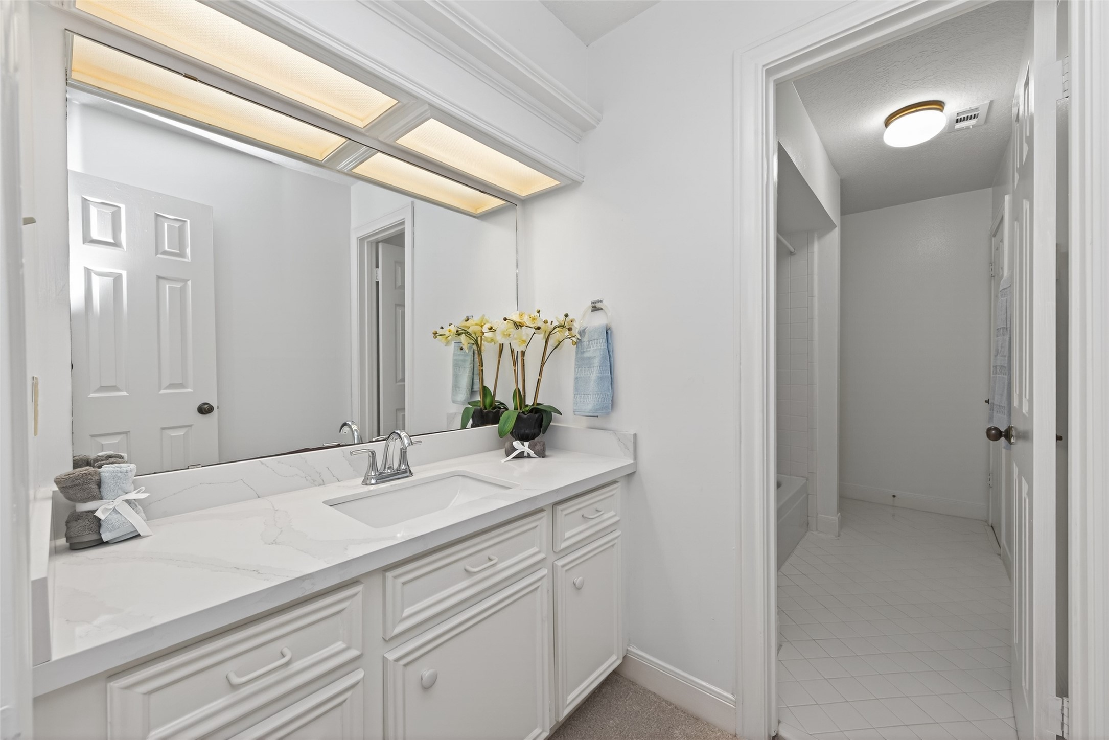 17315 Rothko Lane Spring, TX 77379 - Photo 26 of 50 Bright and elegant bathroom featuring a spacious vanity, new quartz countertops, new sink and water feature.