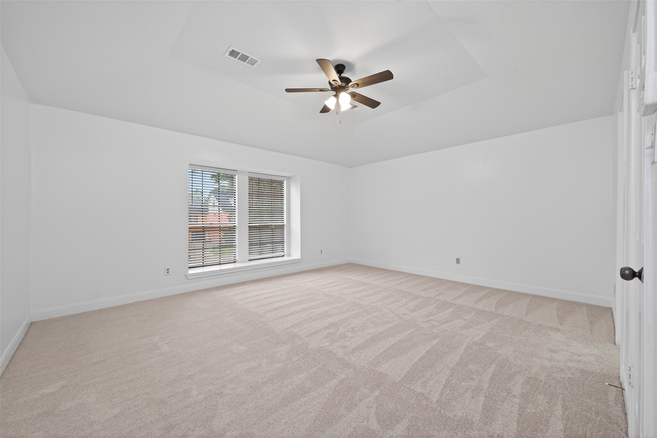 17315 Rothko Lane Spring, TX 77379 - Photo 30 of 50 Spacious bedroom featuring vaulted ceilings, new carpet, and abundant natural light. Designed for comfort and relaxation with an open, aire feel and elegant ambiance.