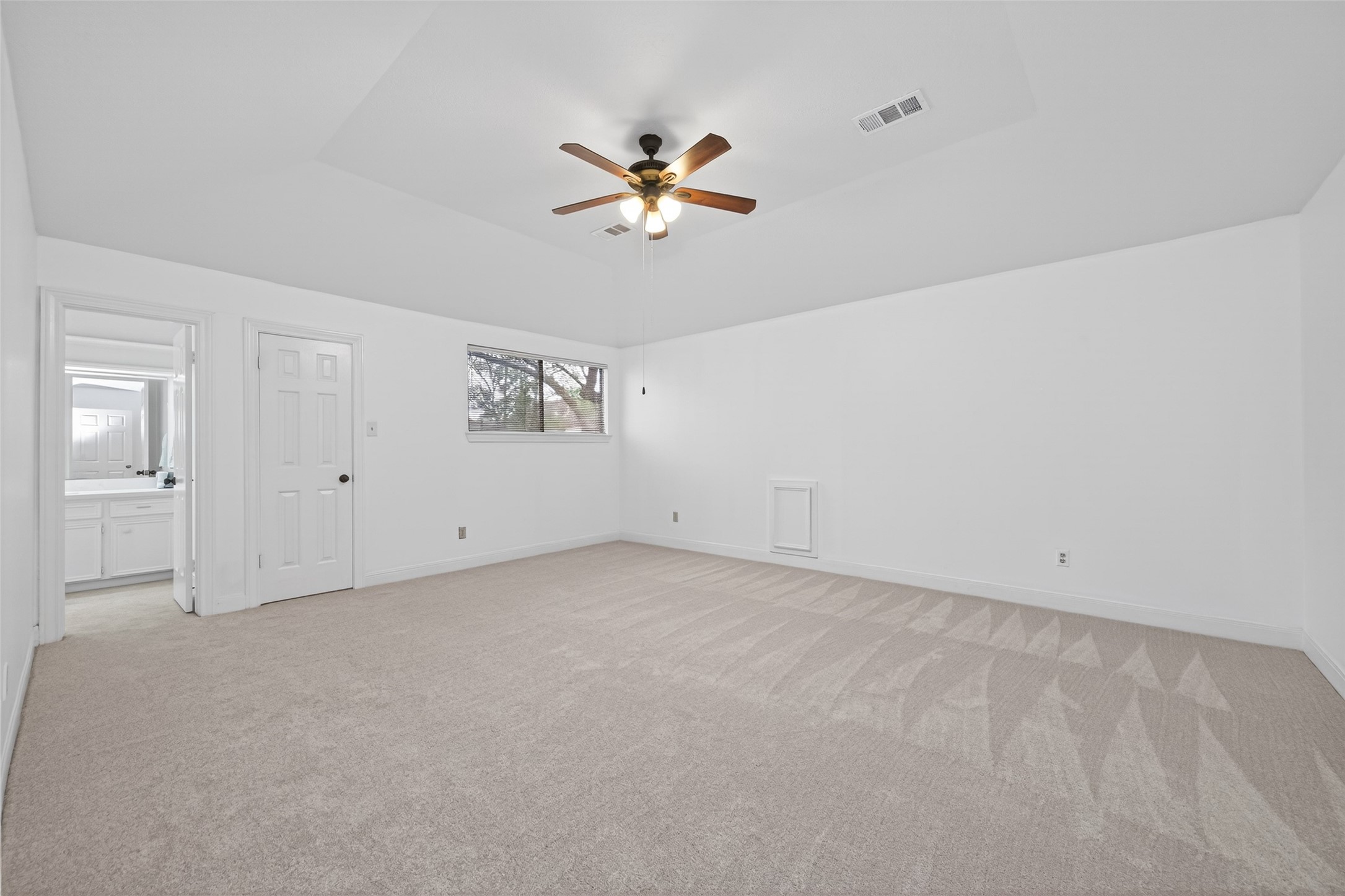 17315 Rothko Lane Spring, TX 77379 - Photo 33 of 50 Spacious bedroom featuring vaulted ceilings, new carpet, and abundant natural light. Designed for comfort and relaxation with an open, aire feel and elegant ambiance.
