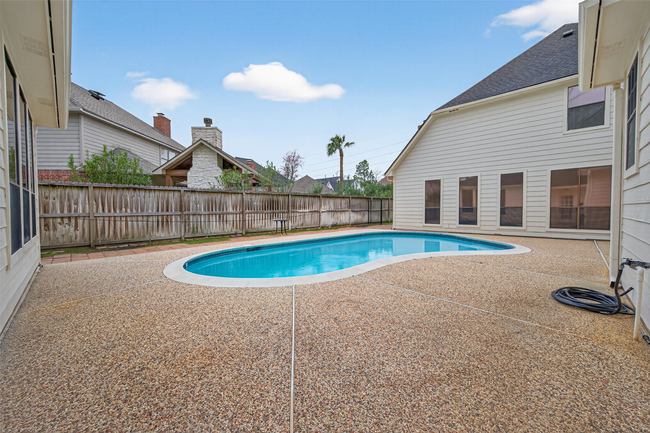 17315 Rothko Lane Spring, TX 77379 - Photo 38 of 50 This private backyard retreat a sparkling in-ground pool and a spacious patio area, perfect for outdoor entertaining and relaxation.
