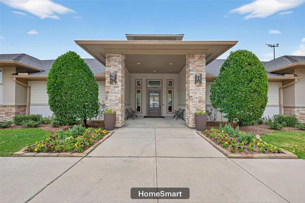 a view of a swimming pool with a yard