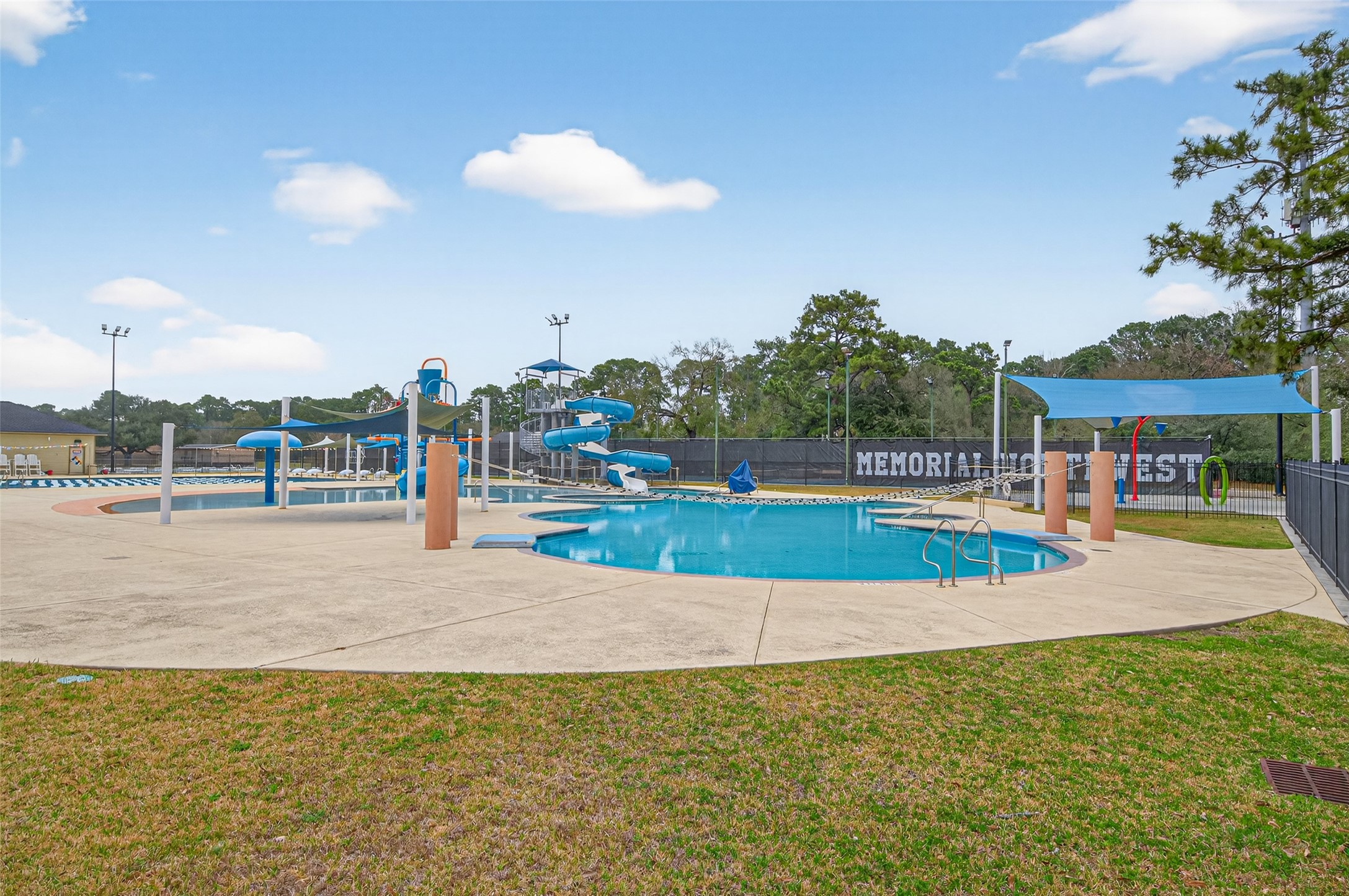 17315 Rothko Lane Spring, TX 77379 - Photo 43 of 50 Resort-style community pool featuring refreshing swimming areas, fun aquatic water park, and shaded seating spaces-perfect for relaxation and family enjoyment.