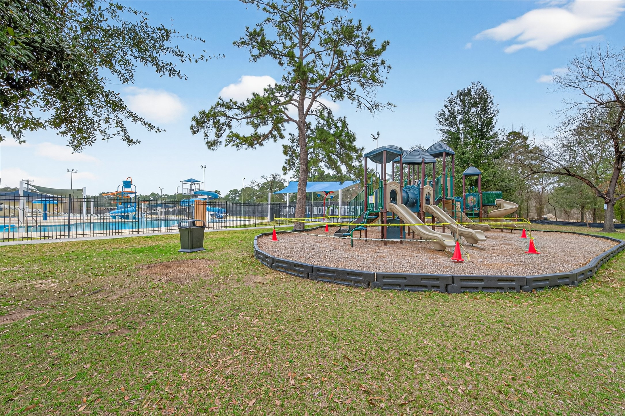 17315 Rothko Lane Spring, TX 77379 - Photo 44 of 50 Family-friendly community playground surrounded by beautiful matures trees, offering a fun and safe environment for outdoor recreation.
